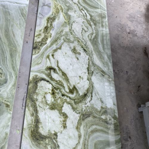 White marble stone with mossy green vein